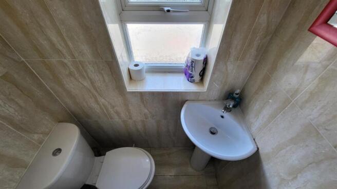 Compact, well-maintained bathroom with a modern...