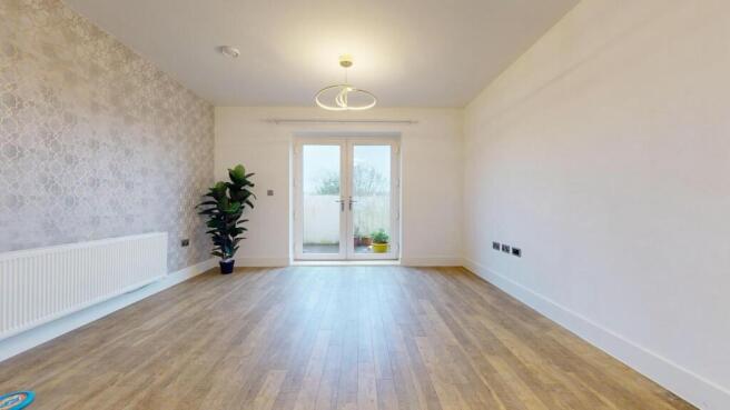 Bright, modern living room with light wood floo...