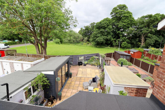 Green space directly behind house
