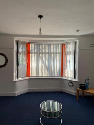 Bright living area with classic bay window...