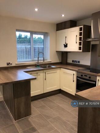 Kitchen With Fitted Dishwasher And Washing Machine