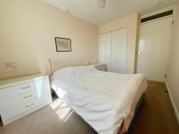 Bed 1 to wardrobe