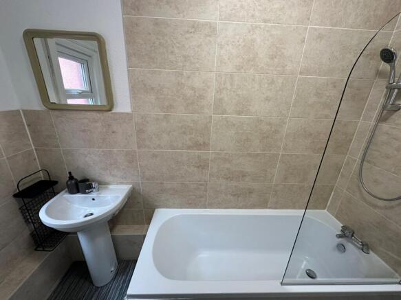 A clean and functional bathroom featuring a bat...