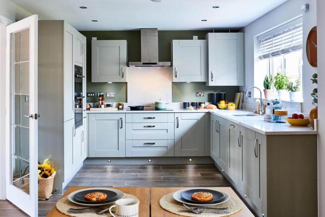 An open plan kitchen and dining area is the hub of the home