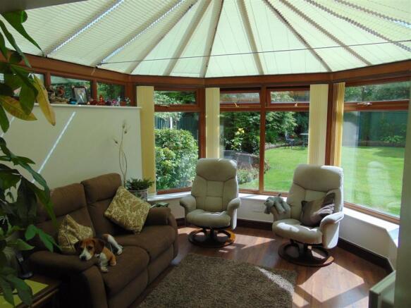DINING ROOM OPENING TO CONSERVATORY