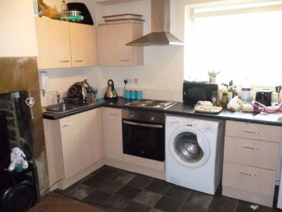 Bright kitchen with modern cabinets, integrated...