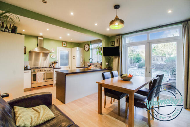 Kitchen dining & family room with french doors to 