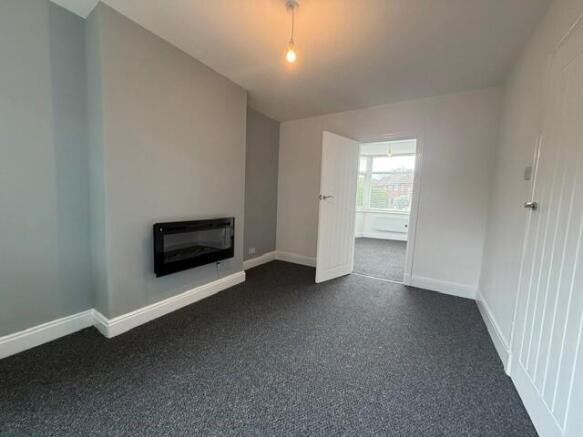 Lounge with door to Bedroom