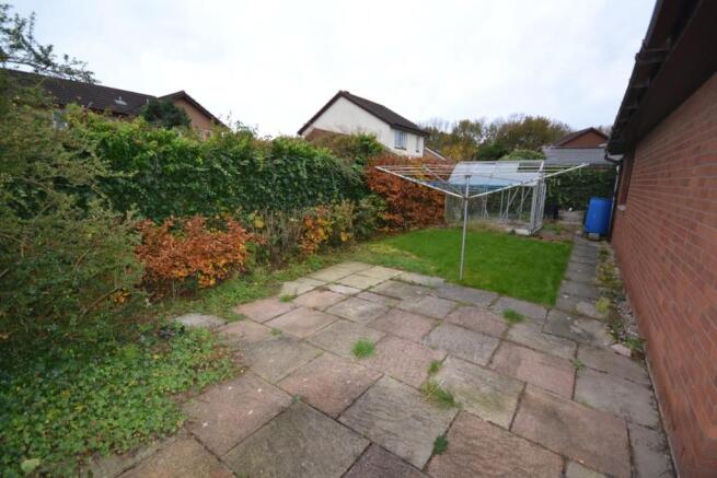 VIEW OF SIDE OF PROPERTY & GARDEN