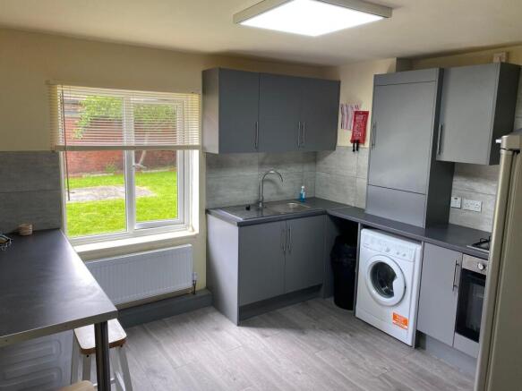 Modern and functional kitchen with ample natura...