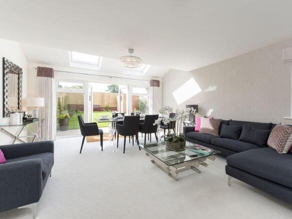 Large lounge/dining area with bi-fold doors to the garden