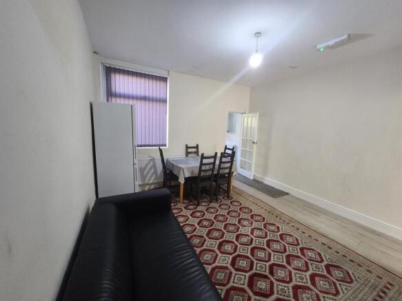 Simple, neutrally decorated living room with a ...