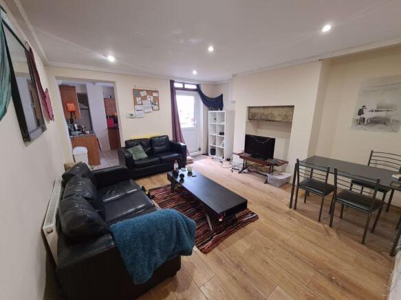 A bright and welcoming living room featuring a ...
