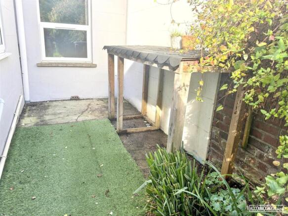 Private courtyard garden with sheltered storage...