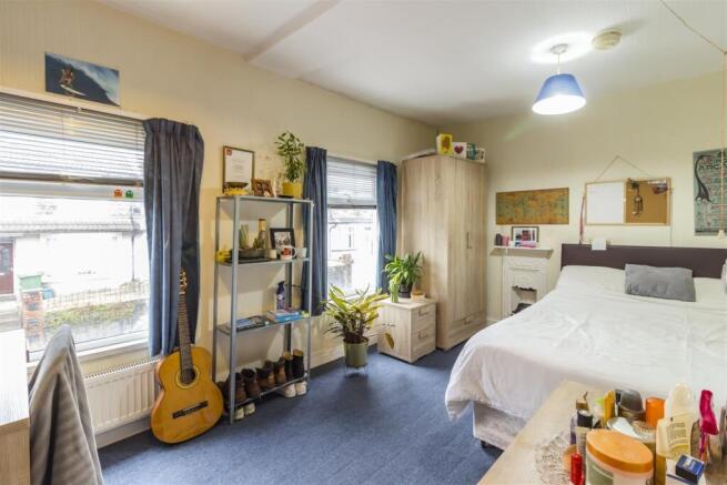 Bright and airy bedroom with ample storage...