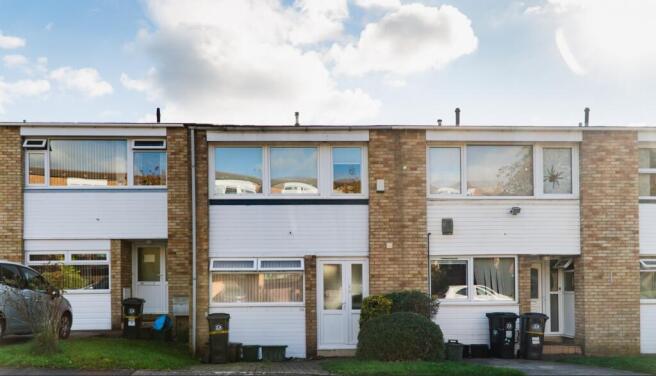 A bright and inviting exterior view of the prop...