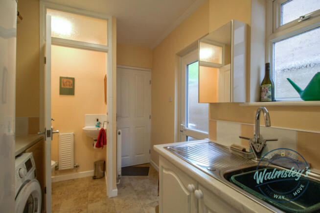 Utility & cloakroom leading to split garage