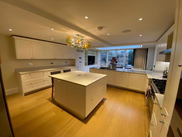 Spacious contemporary kitchen with a central is...