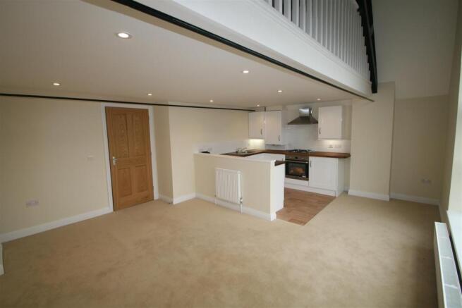 Flat 15 Old School House sitting room kitchen.JPG