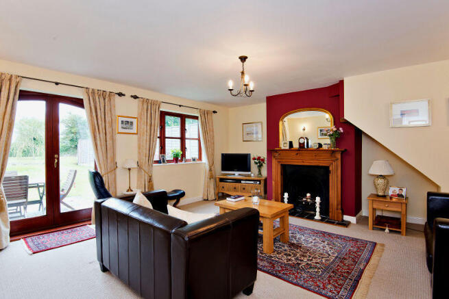 Sitting Room with functioning open fireplace.