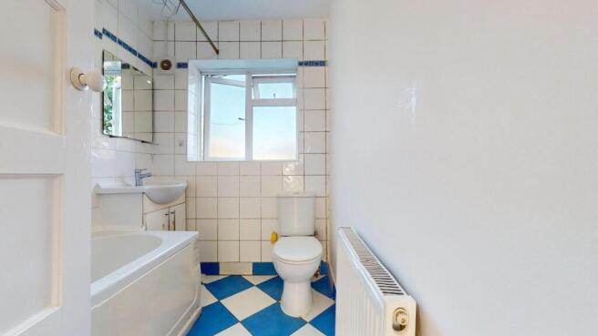 Bright bathroom with a bathtub and natural ligh...