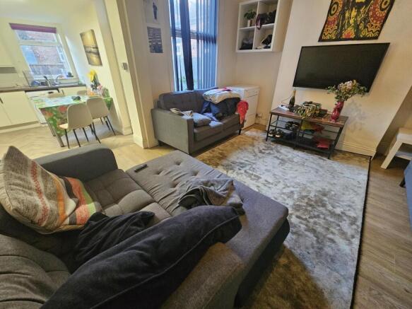 Bright, modern living room with comfortable sof...