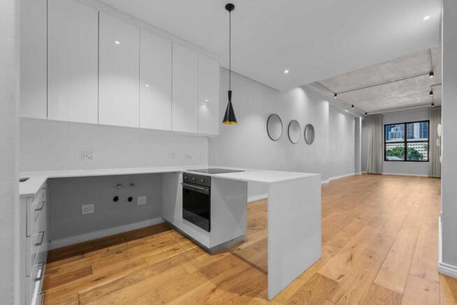 well designed kitchen with undercounter appliances connections