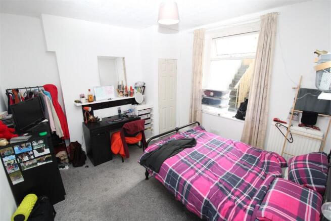 Bright bedroom with desk and ample floor space...