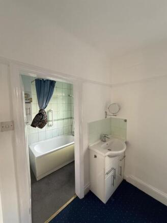 Bright bathroom suite with a modern vanity sink...