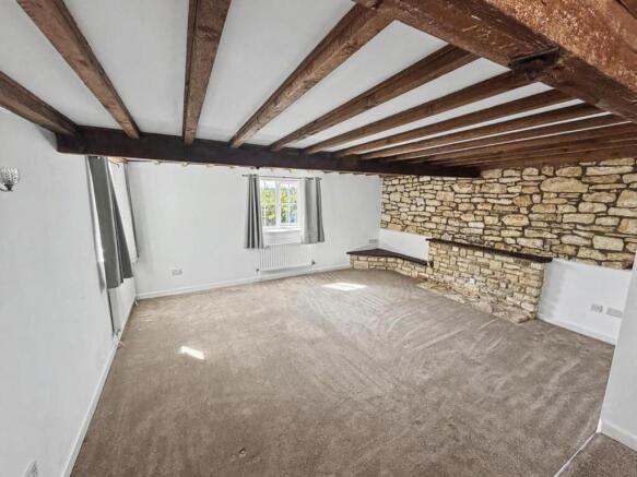 Sitting room with exposed beams