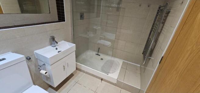 Contemporary tiled bathroom with a walk-in show...