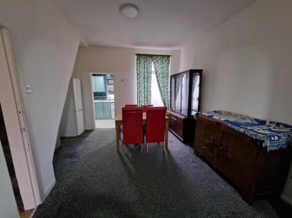 Spacious living area with large dining table...