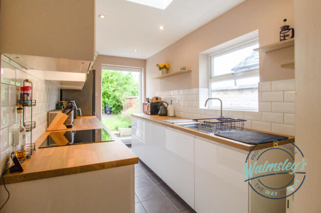 Kitchen with French doors skylight and utility are