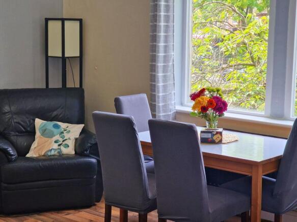 Bright, inviting living/dining area with a comf...