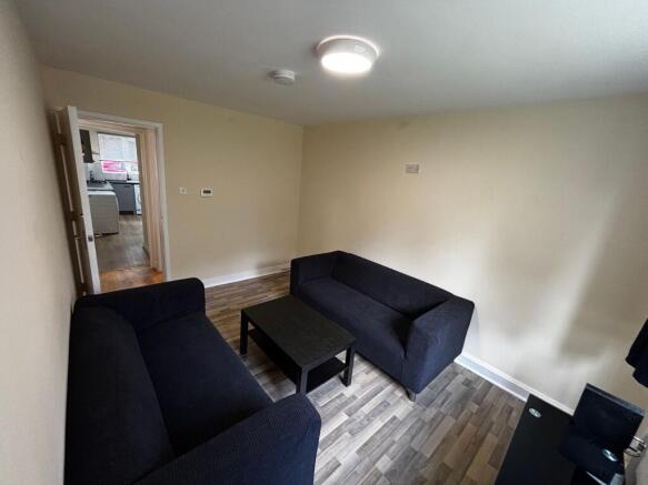 Cosy lounge with comfortable seating and sleek ...