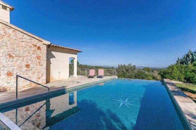 Swimming pool with views across Muro all the way to Alcudia
