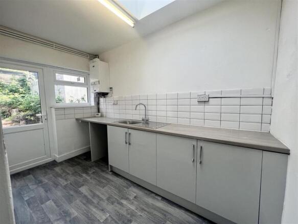 Modern utility space with ample storage storage...