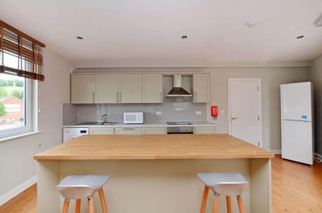 Modern and bright kitchen with ample counter sp...