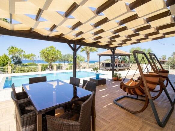 Seafront 4-bedroom magnificent resale villa,1,500 m2 plot size,fully furnished.5m x 10 m private pool,gas central heating,stone double garage,Title deed in the owner?s name VAT paid Image 9999 5