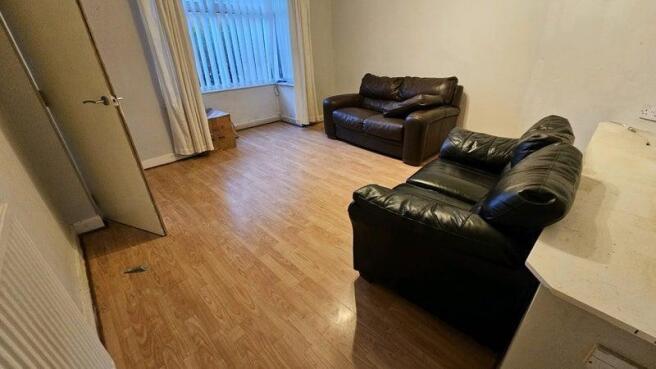 Bright living space with cozy leather sofas...