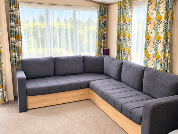 Bright Lounge With Spacious L Shaped Sofa And Larg