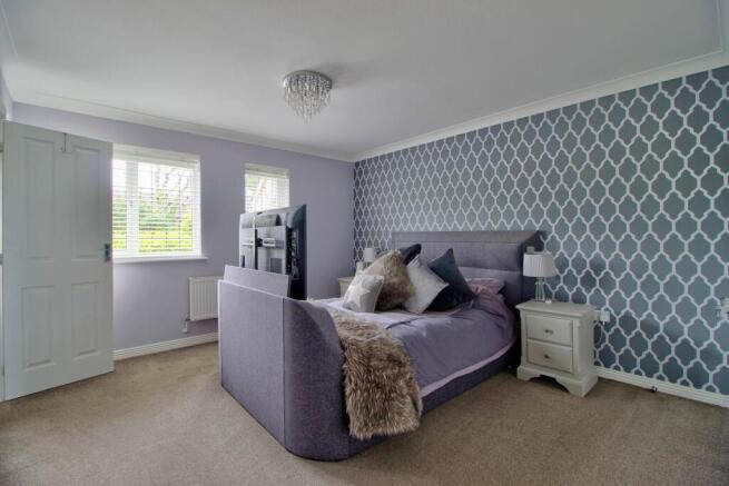 Master Bedroom with range of fitted wardrobes