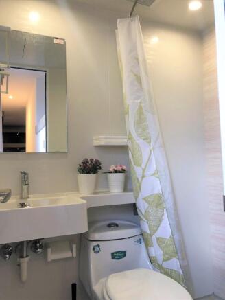 A clean and well-maintained bathroom featuring ...