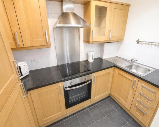 Sleek modern kitchen with integrated appliances...