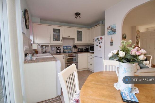 Looking At Kitchen From Dining End