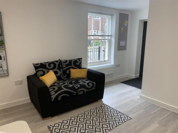 Bright modern lounge with stylish seating area...