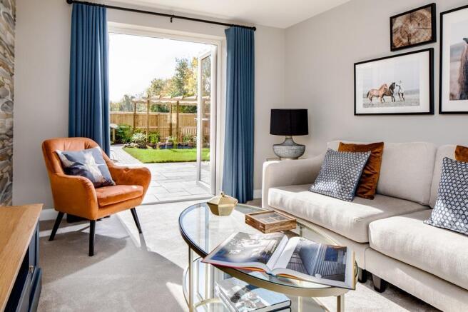 Lounge with French doors open in the Alderney at Coat Grove