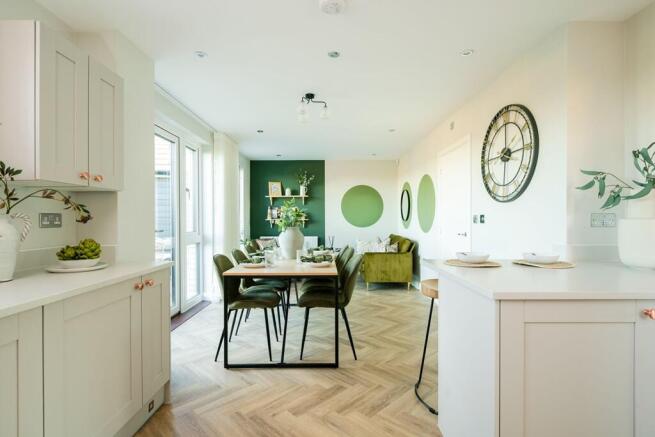 The kitchen area flows seamlessly into the dining and family area