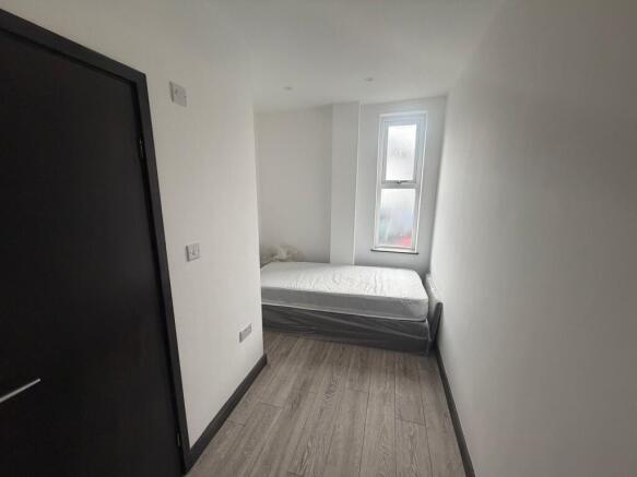 Compact bright room with neat single bed...