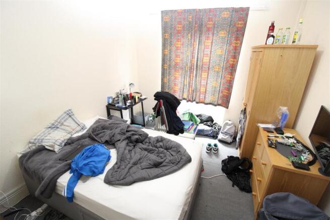 Bright bedroom with ample storage and large bed...
